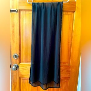 Sheer black shawl with beaded lining. Gently used. Good condition.
